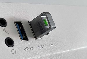 Photo showing the Swissbit U-56n plugged into the USB port of a computer.